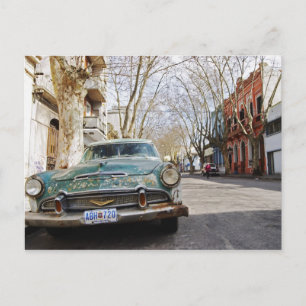 Carte Postale An old car rusty and flaky colour parked in the