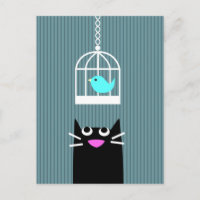 Chat noir et oiseau bleu en cage à oiseaux