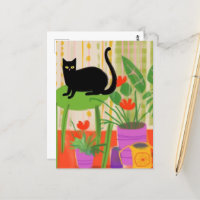 Chat noir sur une chaise verte