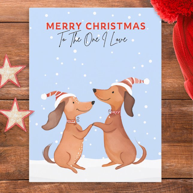Carte Postale Dachshunds Chiens de saucisse Un J'aime Joyeux Noë (A cute postcard featuring two dachshunds in snow. 'Merry Christmas' and 'To The One I Love' words)