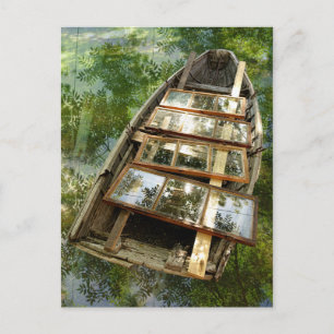 Carte postale d'un bateau en bois dans un lit de f