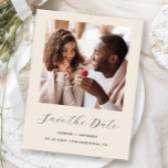 Carte Postale Faire-part Script photo minimal Beige Enregistrer la date<br><div class="desc">Cette carte postale simple et minimaliste Save the Date présente une photo carré au-dessus des mots "Save the Date" dans un élégant script d'écriture manuscrite blanche, suivie des noms du couple, date mariage et ville en sans serif police sur un arrière - plan beige. Ajoutez un message plus détaillé avec...</div>