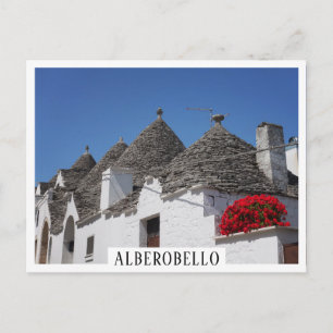 Carte Postale Fleurs de géranium et maisons de trulli à Alberobe