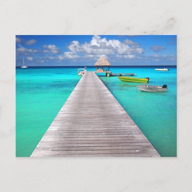 Carte Postale Jetty avec des bateaux dans un lagon tropical (Devant)