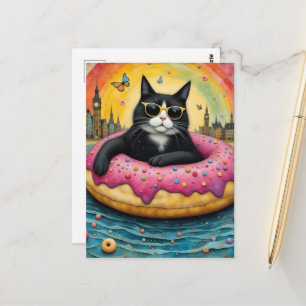 Carte Postale Joli chat noir en vacances dans un donut flottant
