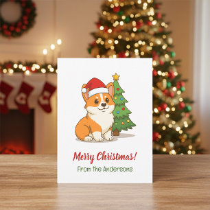Carte Postale Joli chien Corgi avec un chapeau rouge et un sapin