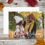 Carte Postale Joyeux Vacances Famille Photo Moderne Minimaliste<br><div class="desc">Elégant Happy Holidays photo carte postale avec belle typographie blanche cursive. Cette carte postale de famille de vacances moderne et minimaliste présente un script magnifique et votre nom en blanc sur la photo de fond.</div>