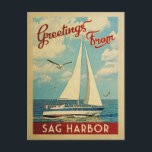 Carte Postale Sag Harbor Sailboat Vintage Travel New York<br><div class="desc">This Greetings From Sag Harbor New York vintage travel nautical design features a boat sailing on the water with seagulls and a blue sky filled with gorgeous puffy white clouds.</div>