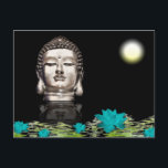 Carte Postale Statue de la tête de Bouddha<br><div class="desc">Une statue de Buddha head silver reflecting on black water filled with floating turquoise lotus flowers and green lily pads. Black background.</div>