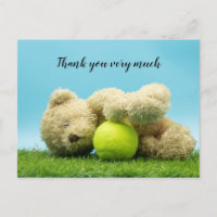 Tennis Teddy L'ours tient une balle de tennis merc