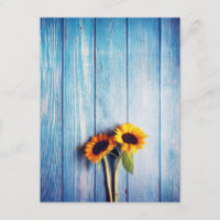 Tournesol sur mur en bois bleu