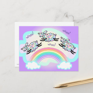 Carte Postale Trois moutons à roues sautant un arc-en-ciel amusa