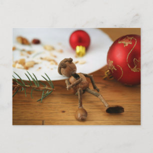 Carte Postale Un elfe de maïs qui mange un biscuit - Noël