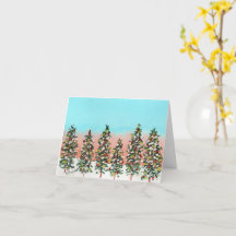 Rangée pré-aube d'arbres de Noël colorés