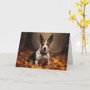 Carte Rat Terrier dans les feuilles d'automne qui tomben