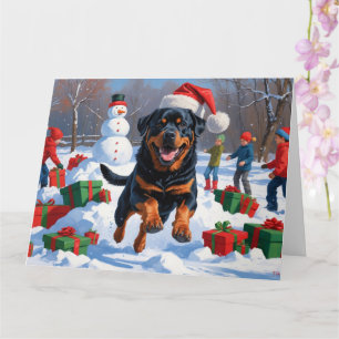 Carte Rottweiler courant dans la neige avec un chapeau d