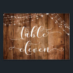 Carte Rustique Brown Wood & Lights Table Eleven<br><div class="desc">Cette suite de designs rustiques et élégants pour mariage et événement présente quelques tendances design mariages populaires combinées de façon fraîche. Avec un riche arrière - plan en bois brun et deux cordes d'accents lumineux scintillants, j'ai combiné une belle police de script moderne pour rendre des graphiques représentant des mots...</div>