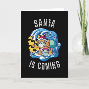 Carte Santa arrive sur planche de surf