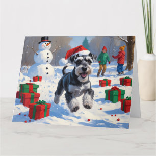 Carte Schnauzer courant dans la neige avec un chapeau de
