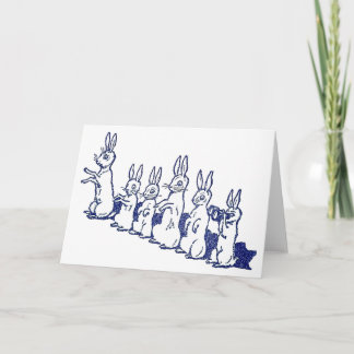 Carte Six lapins reposent et battent leurs pattes