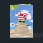 Carte Tropical Christmas Sand Snowman<br><div class="desc">Sable de Noël tropical bonhomme de neige avec casquette rayé rouge et blanc et lunettes de soleil vert sur le sable.</div>