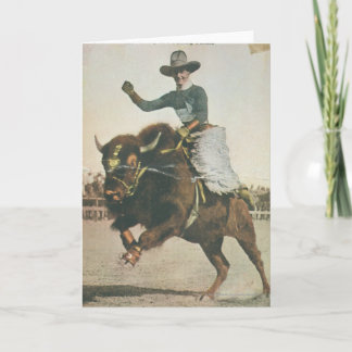 Carte Un joyeux cowboy sur un bison rebutant.