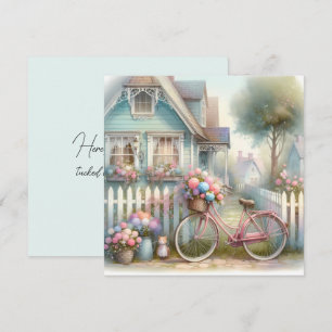 Carte Vélo à fleurs roses à la porte du cottage bleu