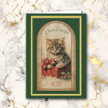 Carte Vintage Image Tabby Kitten Cadeau de Noël<br><div class="desc">L'avant de cette carte de voeux de Noël est ornée d'une belle image vintage d'un adorable chaton tabby assis sur une boîte cadeau rouge avec un arc. Le texte correspondant dit "JOIE DE Noël". L'image est bordée de vert foncé avec un cadre doré et vert. L'intérieur de la carte a...</div>