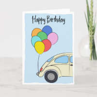 Voiture d'époque et ballons colorés dessinant l'an