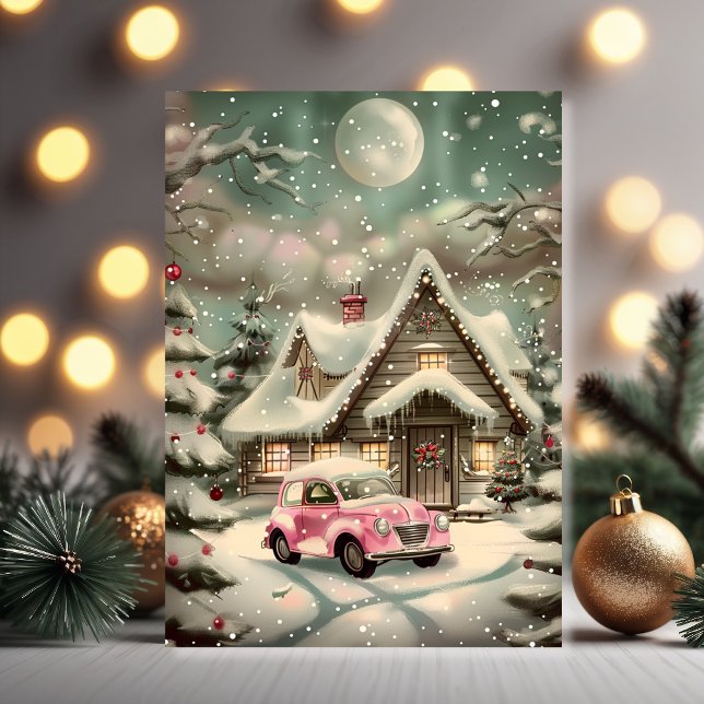 Carte Voiture Rose Vintage en Paysage Hivernal Enchanté (Holiday joy in a winter wonderland with a full moon and cozy cottage glow)