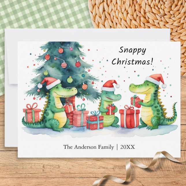Cartes Pour Fêtes Annuelles Amusant Alligator Whimsical Famille Snappy Noël (A funny Christmas card featuring a family of alligators opening festive gifts, in a watercolor style)