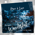 Cartes Pour Fêtes Annuelles Arbre de Noël bleu plat<br><div class="desc">Un beau sapin de Noël enneigé reflète les lumières bleues de la soirée avec "Le plus merveilleux moment de l'année" sur le devant et votre salut de vacances personnel sur le dos. Sélectionnez Matte pour le papier le plus lourd et la haute définition pour une meilleure qualité d'impression.</div>