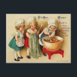 Cartes Pour Fêtes Annuelles Banque A Christmas Plum Pudding Vintage Postcard<br><div class="desc">This is a beautiful reproduction of a vintage Christmas Post Card Showing 3 girld baking a Christmas Plum Pudding; each standing in line to stir the mixture. The actual postcard is from the early 1900 Lac our shop for more great vintage Christmas postcards.</div>