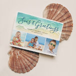 Cartes Pour Fêtes Annuelles Beachal Coastal Blue Trois Photos Seas & Salutatio<br><div class="desc">Envoyez des Bonnes Fêtes chaudes avec cette carte de Noël sur le thème de la plage. Le carte photo de vacances côtier dispose d'une vague d'aquarelle vert mer sur une rive sablonneuse. Joli script dit "Mers & salutations" en calligraphie bleu-vert lettrage. Trois photos se trouvent sous la vague peinte. Pour...</div>