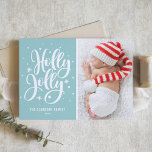 Cartes Pour Fêtes Annuelles Blue Holly Jolly Hand Lettering Baby Photo<br><div class="desc">Carte Festive Holly Jolly Lettrée à la main | Envoyer des salutations festives en famille et entre amis avec cette carte de séjour personnalisable. Il présente une superposition "holly jolly" percée à la main avec un accent de neige et de flocons de neige. Customisez en ajoutant votre photo préférée. Des...</div>
