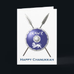 Cartes Pour Fêtes Annuelles Bouclier Maccabee Et Paroles<br><div class="desc">Représentation d'un bouclier de Maccabee et de deux lances accrochées au mur. Bataille usée et rouillée, mais toujours en service. Le bouclier est orné d'un lion et d'un texte lisant "Yisrael" (Israël) dans l'alphabet paléo-hébreu. "Heureux Chanoukah" apparaît également. Ajoutez votre propre texte. Les Maccabées étaient des rebelles juifs qui ont...</div>