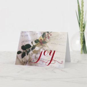 Cartes Pour Fêtes Annuelles Branche de houx sur la musique de feuille pour