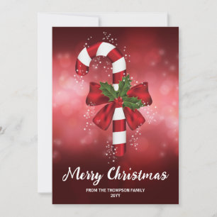 Cartes Pour Fêtes Annuelles Canne en bonbon rouge sur un fond bokeh rouge