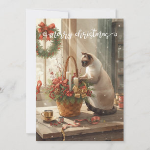 Cartes Pour Fêtes Annuelles Chat arrangeant des fleurs hivernales pour Noël
