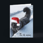 Cartes Pour Fêtes Annuelles Chat De Noël En Neige Profonde<br><div class="desc">Un chat noir moelleux aux flocons de neige et portant un casquette du Père Noël marche à travers un sentier enneigé profond</div>