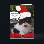 CARTES POUR FÊTES ANNUELLES CHRISTMAS CHAT AVEC CASQUETTE SANTA CLAUS ET RIBBO<br><div class="desc">"Joyeux et brillant Noël "Chat impressionnant et magnifique aux yeux verts jaunes et arc rouge,  ruban et pierre de rubis. Photo de Bulgan Lumini (c)</div>