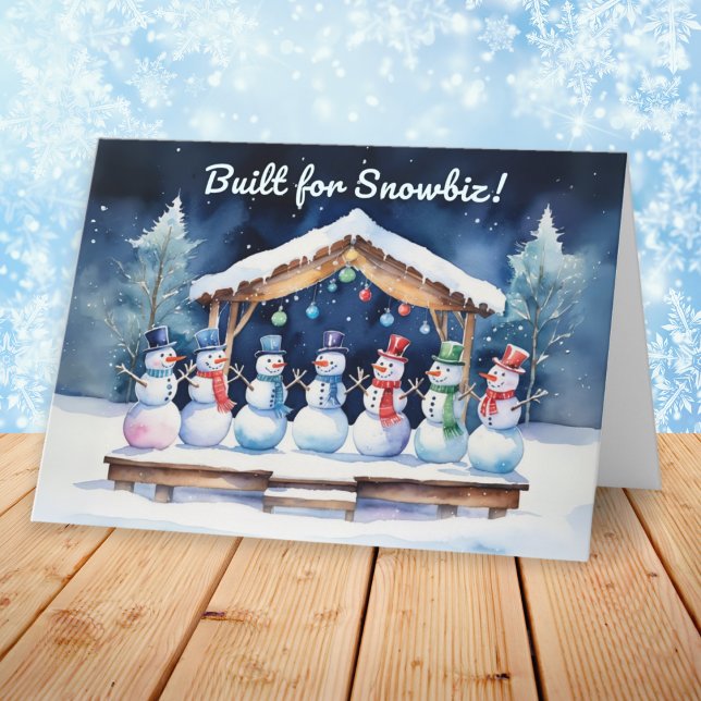 Cartes Pour Fêtes Annuelles Conçu pour Snowbiz Funny Snowmen Noël (A funny Christmas card with picture of snowmen on a wooden stage, with humorous caption)