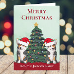Cartes Pour Fêtes Annuelles Deux Chiens De Corgi Tricolore Cute Personnalisé N<br><div class="desc">Ces magnifiques chiens de corgi gallois Pembroke ont la tête inclinée à l'intérieur d'un mignon casquette du Père Noël. Les deux petits sont assis devant un joli sapin de Noël orné de décorations colorées. Une belle carte de vacances corgis avec un magnifique dessin d'un duo de corgi rouge et blanc....</div>