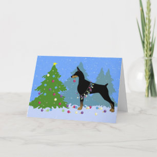 Cartes Pour Fêtes Annuelles Dobermann décorant l'arbre dans la forêt