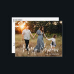 Cartes Pour Fêtes Annuelles Élégant script photo moderne Noël<br><div class="desc">Carte postale moderne de Noël photo avec un design simple et minimal avec l'accueil "Joyeux Noël" dans un élégant script blanc avec votre nom de famille.</div>