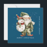 Cartes Pour Fêtes Annuelles Gnome et Snowman Joyeux Noël d'affaires Appartemen<br><div class="desc">Un gnome habillé de rouge se dresse à côté d'un bonhomme de neige dans un elfe vert, le casquette et le foulard rouge. Ils sont entourés d'une poussière de neige blanche qui s'opère sur l'arrière - plan bleu foncé. L'esthétique minimaliste est créée avec un simple Joyeux Noël ci-dessous et le...</div>
