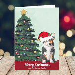 Cartes Pour Fêtes Annuelles Joli Tricolor Corgi de Noël avec Queue personnalis<br><div class="desc">Ce beau tricolore Pembroke Welsh Corgi a la tête inclinée à l'intérieur d'un mignon casquette du Père Noël. Le chiot avec une queue est assis devant un joli sapin de Noël décoré d'ornements colorés. Joyeux Noël est écrit sur le devant en jolie cursive sur cette carte de vacances personnalisée propriétaire...</div>