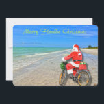 Cartes Pour Fêtes Annuelles Joyeux Noël Floride Sanibel Island Beach Père Noël<br><div class="desc">Joyeux Noël en Floride ! Cette magnifique carte de vacances Flat Card présente une photo de la plage sensationnelle de l'île de Sanibel avec les belles eaux bleues/vertes du golfe du Mexique. Le design festif comprend Père Noël à vélo pour livrer des colis sur cette oasis insulaire. Le dos de...</div>
