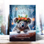 Cartes Pour Fêtes Annuelles Koala Bear Snowy Winter Forest Noël joyeux<br><div class="desc">Cette adorable carte de voeux de vacances présente une jolie illustration de l'ours de Koala portant une couronne festive de fleurs d'hiver, de saints, de pins et de baies, avec des flocons de neige tombant doucement contre un arrière - plan de forêt de neige d'hiver. Le petit Ours de Koala...</div>