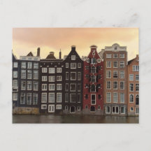 Maisons du canal d'Amsterdam au coucher du soleil